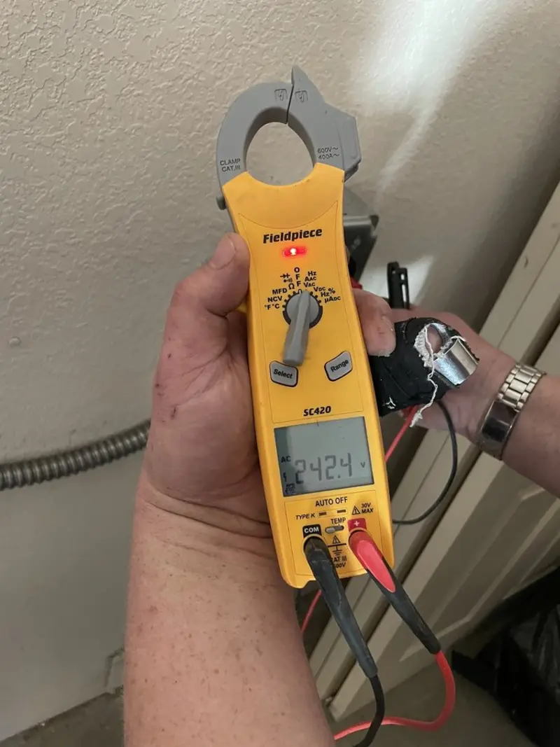 Voltage testing with clamp meter during Circuit Breaker Repair in Dulles Town Center